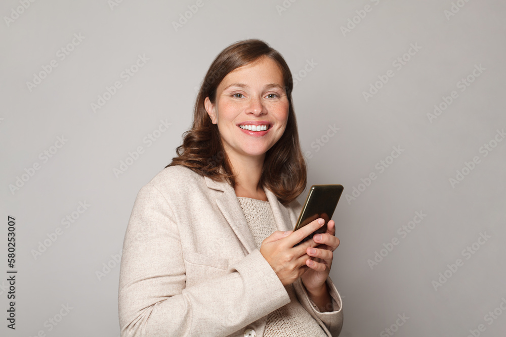 Pregnancy, technology and people concept. Beautiful happy pregnant woman using smartphone, portrait Pregnancy, technology and people concept. Beautiful happy pregnant woman using smartphone, portrait