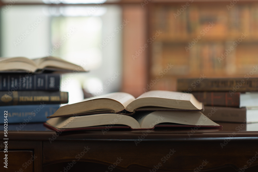 books stacked on desk in library. legal education or law learning. books stacked on desk in library. legal education or law learning.