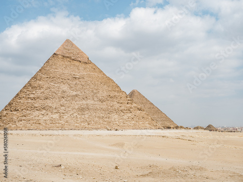 Giza pyramid complex. Photo of pyramids on a clear  sunny day against a blue sky. Vacation and travel concept