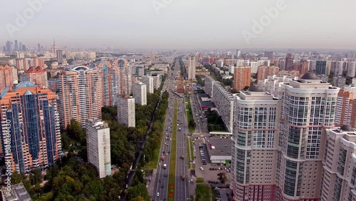 Aerial view of a green area with a very developed infrastructure. Establishing shot on Leninsky Prospekt Street in Moscow. Modern high-rise buildings photo