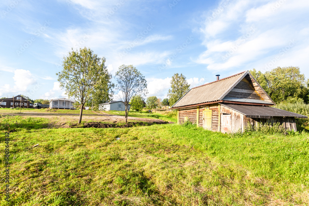 Traditional russian wooden bath house at the countryside in summer Traditional russian wooden bath house at the countryside in summer