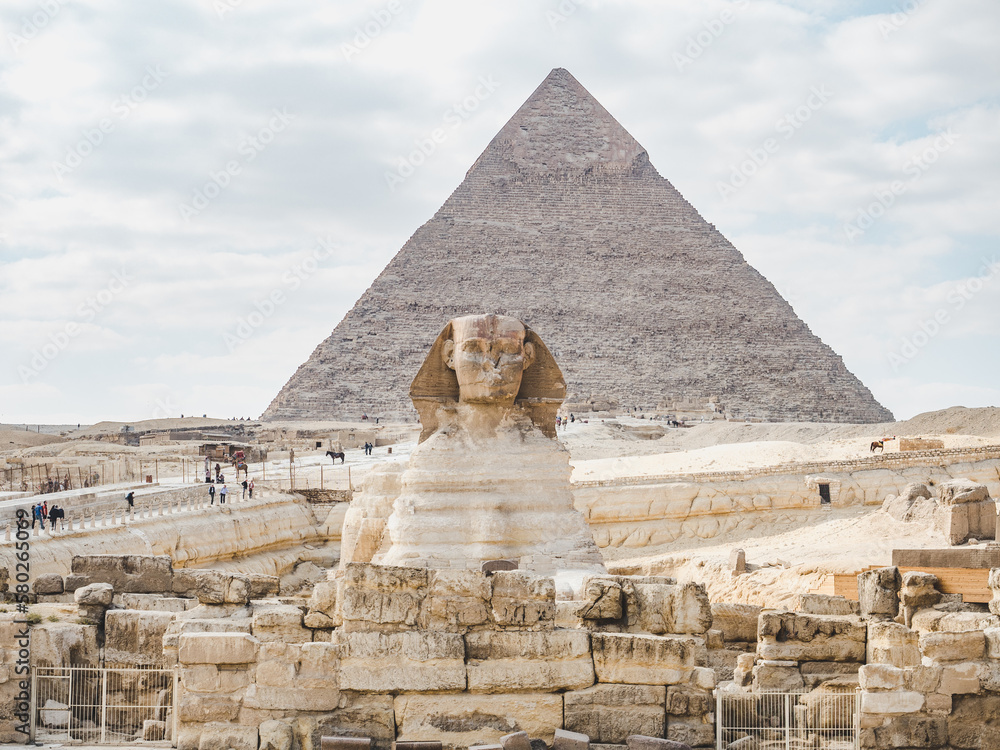 Giza pyramid complex. Photo of pyramids on a clear, sunny day against a blue sky. Vacation and travel concept Giza pyramid complex. Photo of pyramids on a clear, sunny day against a blue sky. Vacation and travel concept