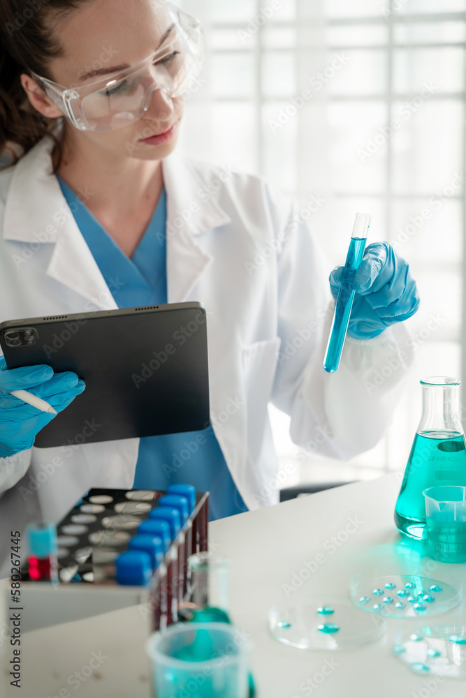 Female biotechnologist testing new chemical substances in a laboratory. Female biotechnologist testing new chemical substances in a laboratory.
