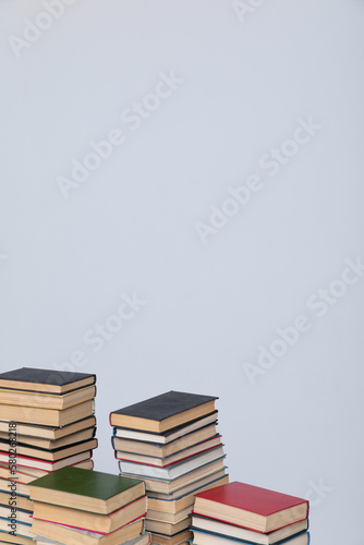 lots of books on a table on a white background in the library of science knowledge reading