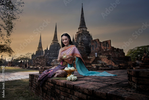 Portrait woman in a dress. woman in a dress. Beautiful woman in Thai traditional in Ayutthaya, Thailand. © VIEWFOTO STUDIO