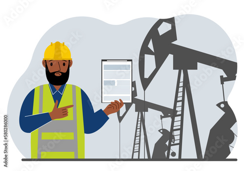 A male refinery engineer worker uses a tableted oil pumping unit. Energy industrial zone, oil drilling.