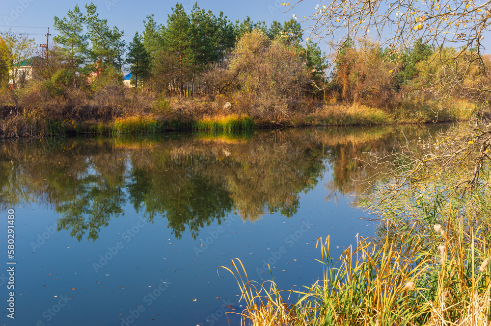 seasonal landscape with small Ukrainian river Oril in Yelizavetovka village, Ukraine in fall of the leaves time seasonal landscape with small Ukrainian river Oril in Yelizavetovka village, Ukraine in fall of the leaves time