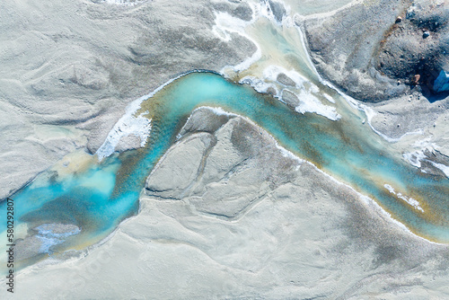 Obraz na płótnie Drone view of the azure river in the glacier valley. View of the moraines. Landscape from the air. River on a moraine. Landscape from drone. Alberta, Canada. w salonie