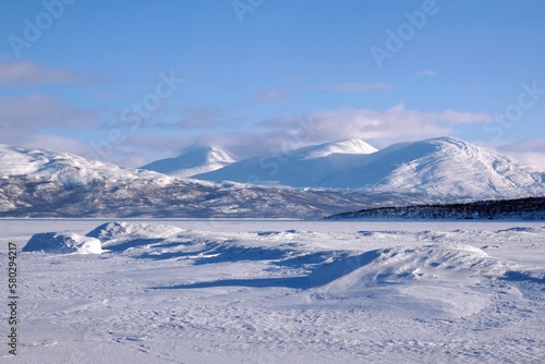 Beautiful scenery of frozen and snowy Lake Torneträsk (Tornestrask) around Abisko National Park (Abisko nationalpark). Sweden, Arctic Circle, Swedish Lapland © Iwona