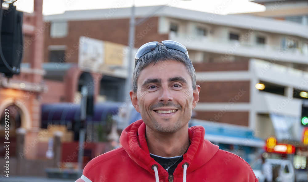 Portrait of a happy caucasian man during a city tour Portrait of a happy caucasian man during a city tour