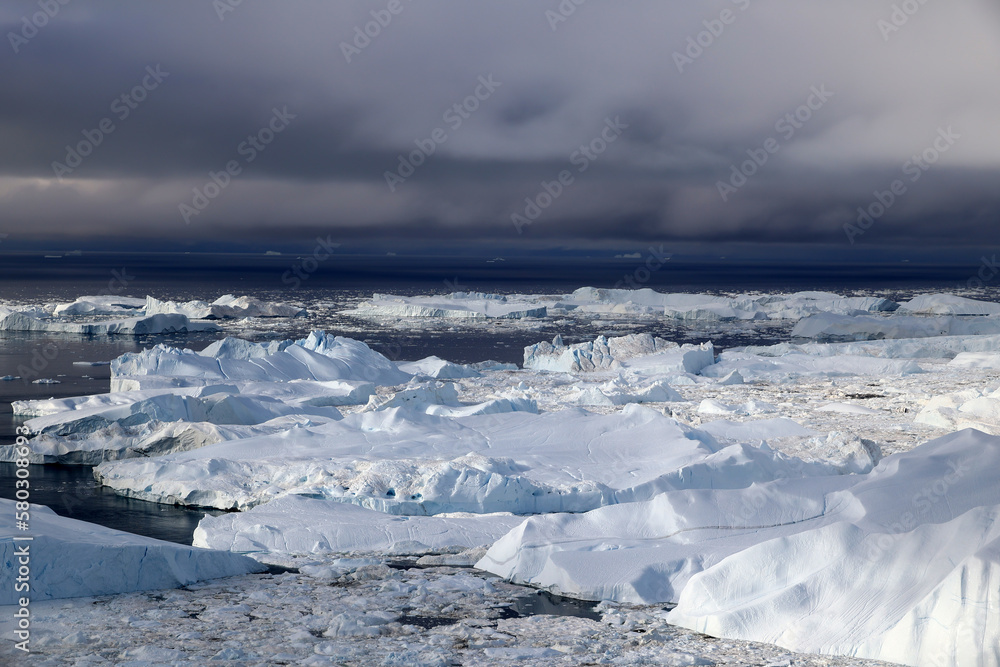 Icebergs from Sermeq Kujalleq Glacier, also known as Ilulissat Glacier, in Disko Bay, Greenland, Denmark Icebergs from Sermeq Kujalleq Glacier, also known as Ilulissat Glacier, in Disko Bay, Greenland, Denmark