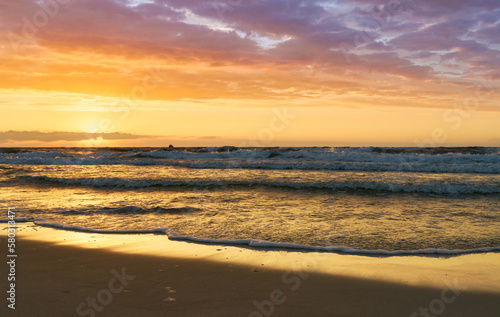 Sunset on Baltic Sea white bright golden orange color and rough sea  © Marek Walica