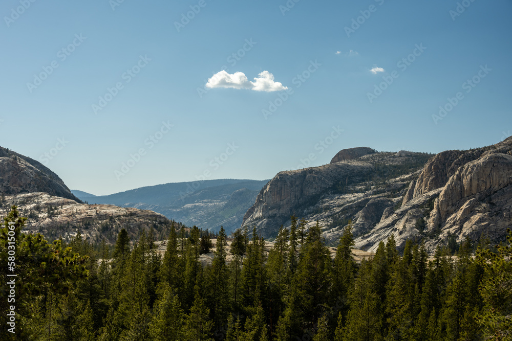 Sparse Clouds Hang Over Grantive Outcropping In The High Sierra Of Yosemite