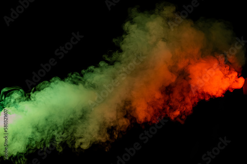 Red yellow green smoke on a black background.