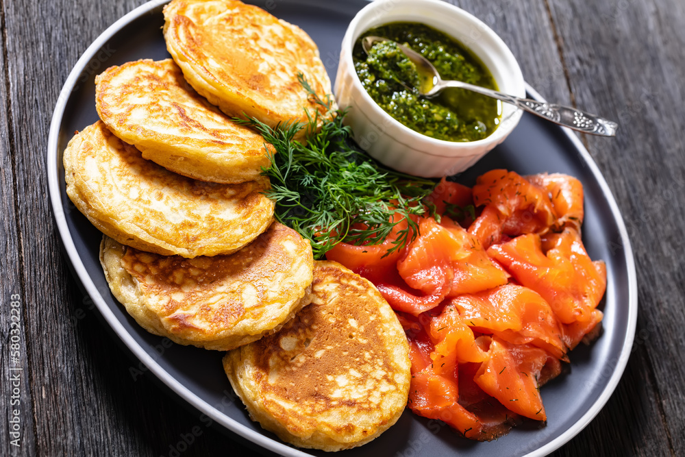 pancakes with sliced cold smoked salmon, top view pancakes with sliced cold smoked salmon, top view
