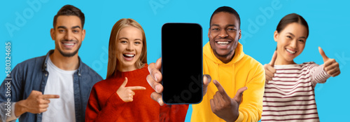 Happy shocked multiracial people point finger at smartphone with blank screen, enjoy win