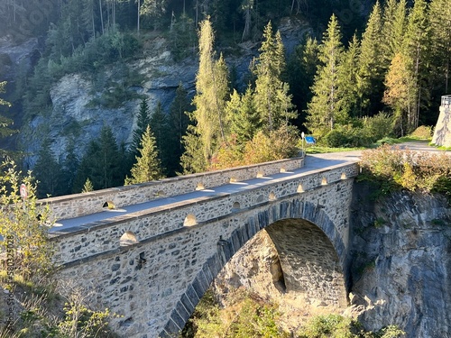 The old stone arch bridge over the river Albula and the Schin canyon (Schinschlucht or Schynschlucht) and next to the Solis viaduct, Albula - Canton of Grisons, Switzerland (Schweiz) photo