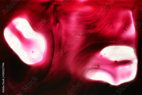 Abstract magenta background. Alcohol ink streaks and stains of wine color  paint splashes