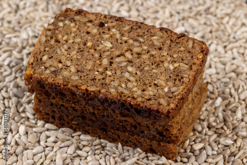 Black rye bread cut into chunks with sunflower seeds