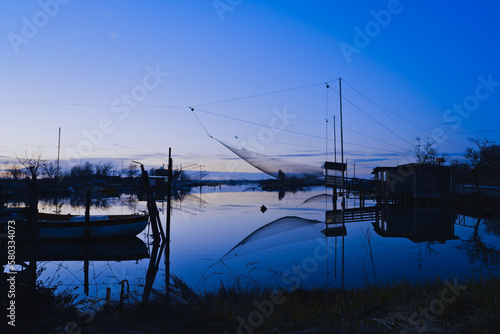 Fishing hut in dep blue at Pialassa della Baiona photo