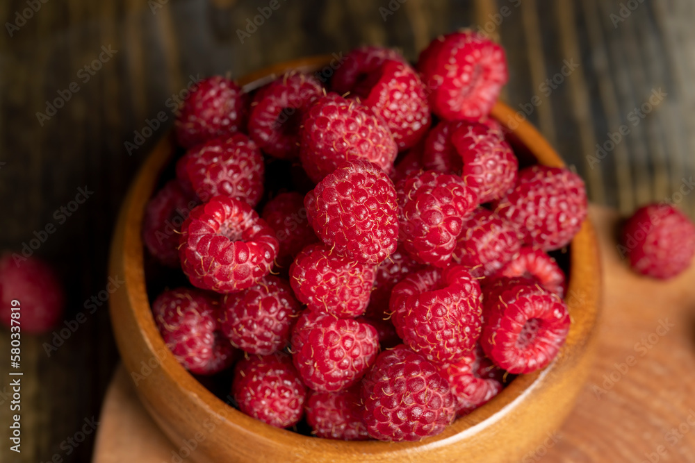 Harvested red ripe raspberries in the kitchen Harvested red ripe raspberries in the kitchen