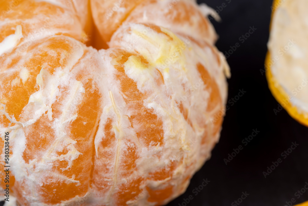 Peeled tangerines on the table, close up Peeled tangerines on the table, close up
