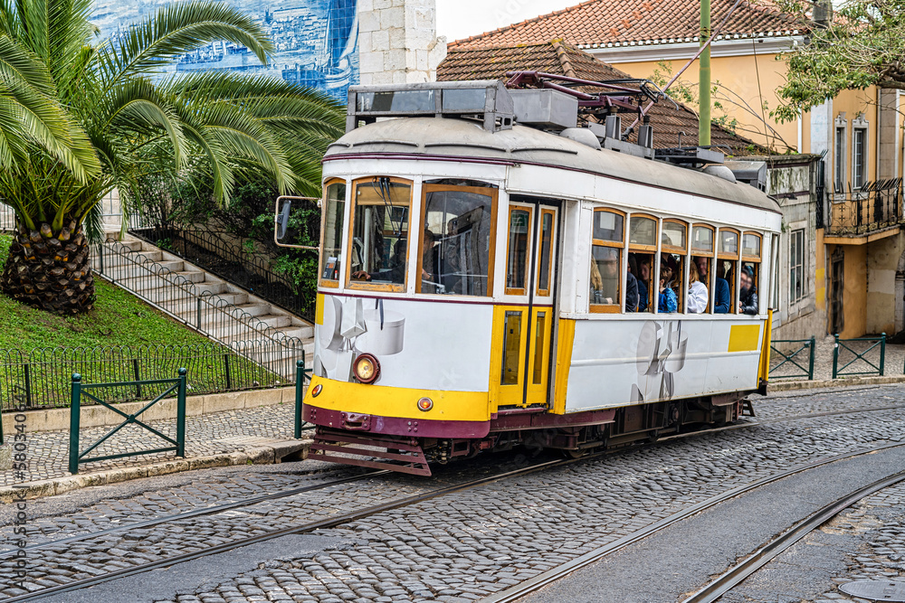 Classic View Of The Historic And Traditional Trams That Run Through The Famous Lisbon Street. Portugal, Europe