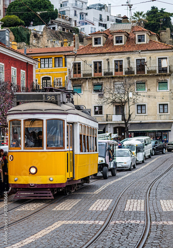 Famous Vintage Tram In The Center Of Lisbon Old Town Picking Up Passengers. Travel Concept