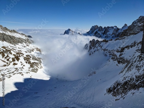 Ski tour just above the sea of fog. Lake of Fog. Mountaineering in winter in the Alpstein region of Switzerland. Skiing in the Alps. Appenzell Toggenburg Säntis. High quality photo.