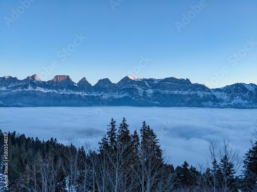 Above the sea of fog. Enjoy the sun and the beautiful weather in the Alps.View of the Churfirsten and Tannenboden. Walensee photo