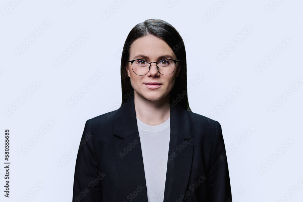 Smiling young business woman looking at camera on white background Smiling young business woman looking at camera on white background
