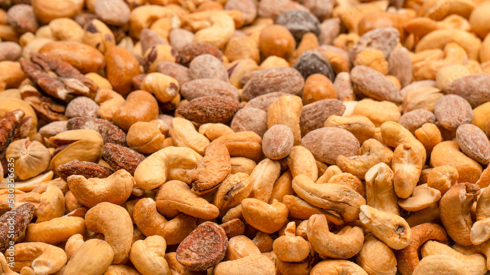 A group of almonds, pistachios, walnuts, macadamia, cashews. A group of almonds, pistachios, walnuts, macadamia, cashews.