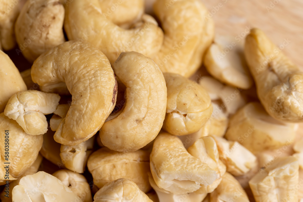 scattered pile of cashew nuts scattered pile of cashew nuts