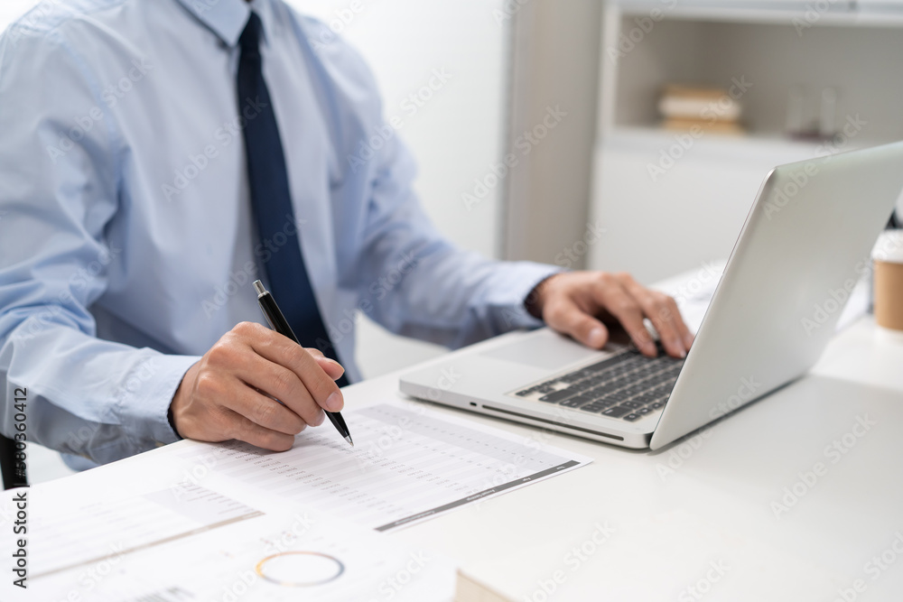 Business man working by using laptop computer Hands typing on a keyboard. Professional investor working new start up project. business planning in office. Technology business Business man working by using laptop computer Hands typing on a keyboard. Professional investor working new start up project. business planning in office. Technology business