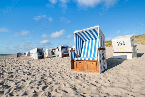 Summer vacation in a beach chair at the North Sea coast on Sylt, Schleswig-Holstein, Germany photo