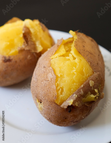 close-up of boiled whole potatoes in the plate,boiled large potatoes with the peel,