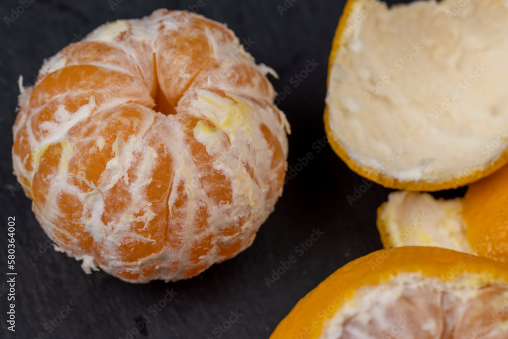 Peeled tangerines on the table, close up Peeled tangerines on the table, close up
