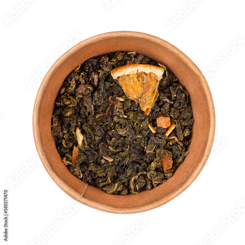 Orange oolong in cardboard round box. Green tea, oolong, with orange pieces, top view.