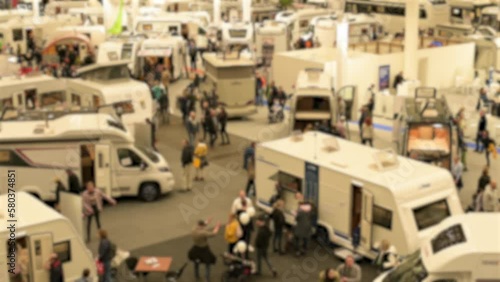 Blurred mobile home fair with various mobile home providers on the exhibition center in Hamburg 