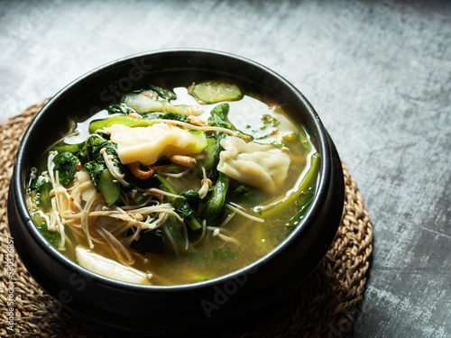 Soybean paste stew made with various vegetables and flour dough	 photo