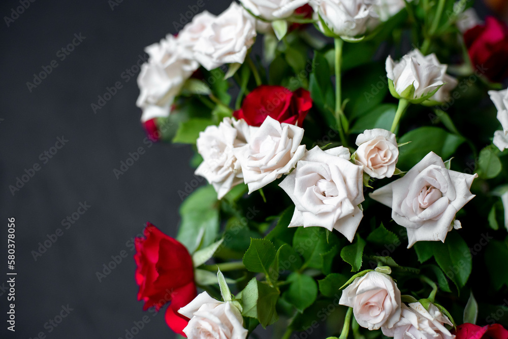 bouquet of red and white roses on a stone background with copy space for your text bouquet of red and white roses on a stone background with copy space for your text