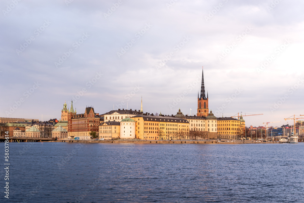 Sunset over Riddarholmen church in old town Stockholm city, Sweden