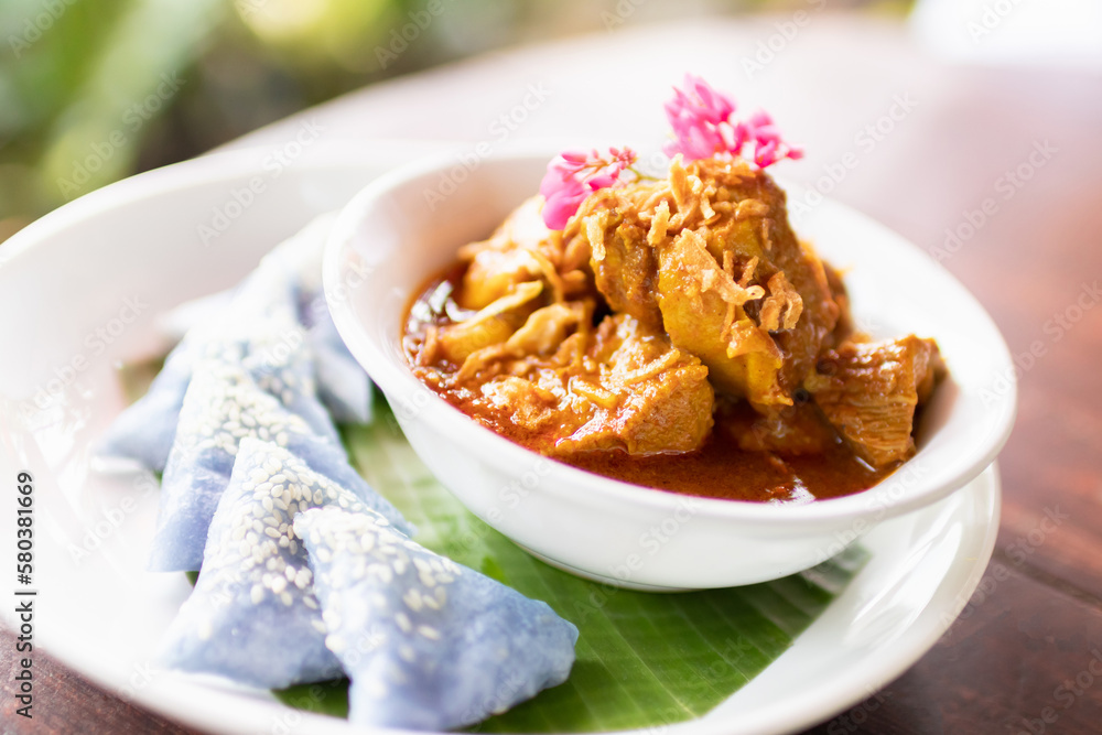 'Hung Lay' curry with pork served with steamed glutinous rice. This curry from northern Thailand is like no other. Slow-simmered, slightly sweet and tangy, and full of rich, complex flavors. 'Hung Lay' curry with pork served with steamed glutinous rice. This curry from northern Thailand is like no other. Slow-simmered, slightly sweet and tangy, and full of rich, complex flavors.