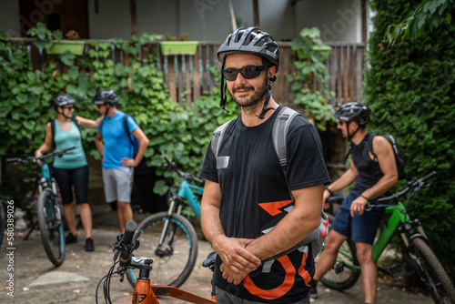 man caucasian male ride electric bicycle e-bike with friends in summer © Miljan Živković