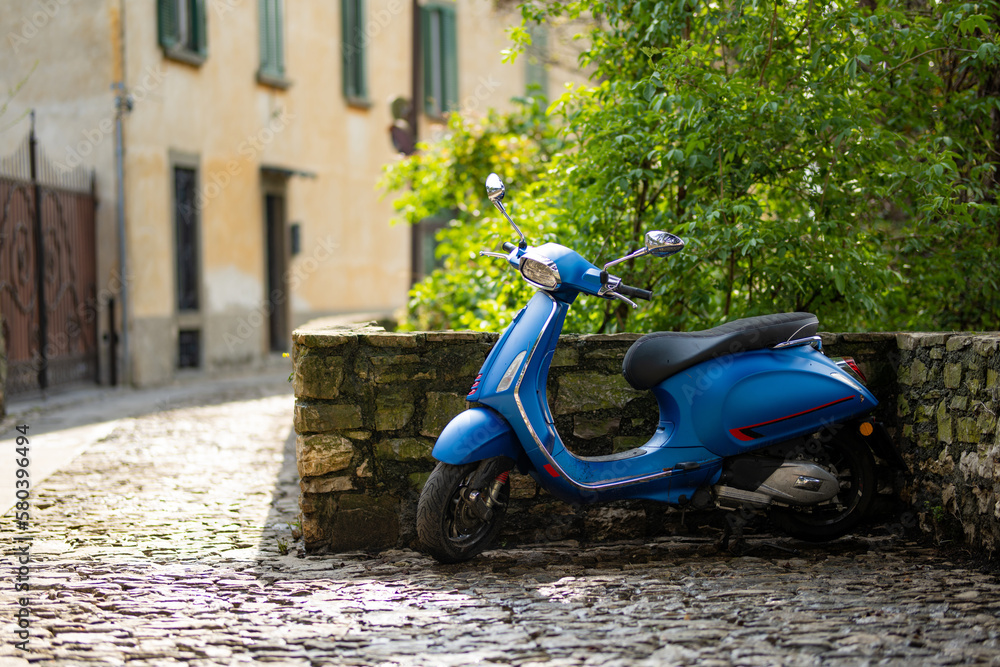 Trendy motorcycle parked on the street of Bergamo, in Citta Alta, town's upper district, known by cobblestone streets and encircled by Venetian walls. Bergamo, Italy.