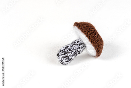 handmade knitted mushrooms isolated on white background photo