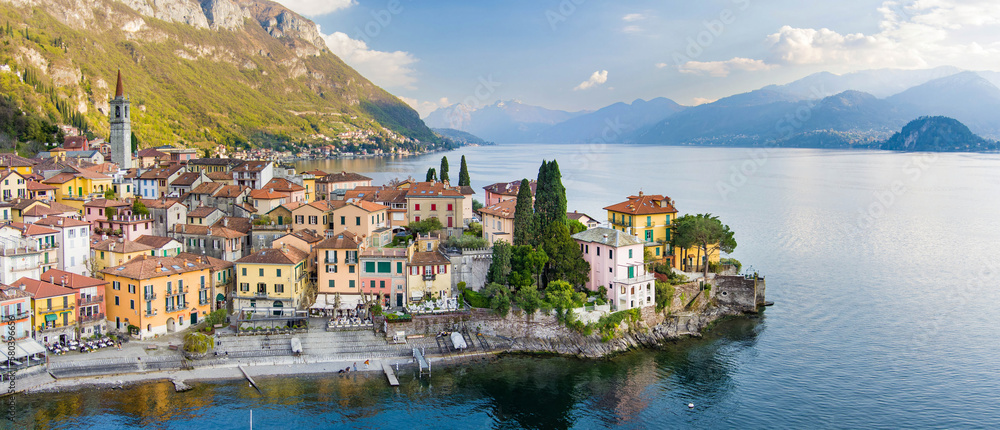 Beautiful aerial waterfront cityscape of Varenna, one of the most picturesque towns on the shore of Lake Como. Charming location with typical Italian atmosphere. Varenna, Italy.
