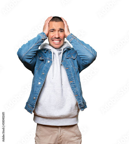 Crazy young man making a gesture of despair