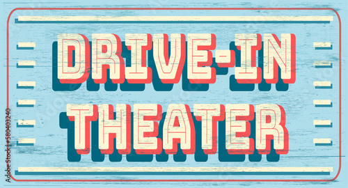 Vintage drive-in theater sign on wood grain