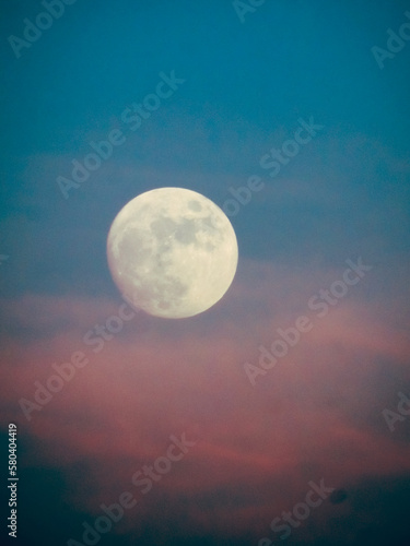 full moon over the clouds
